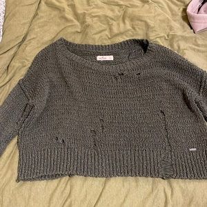 Small Hollister Olive green sweater with fashion rips.